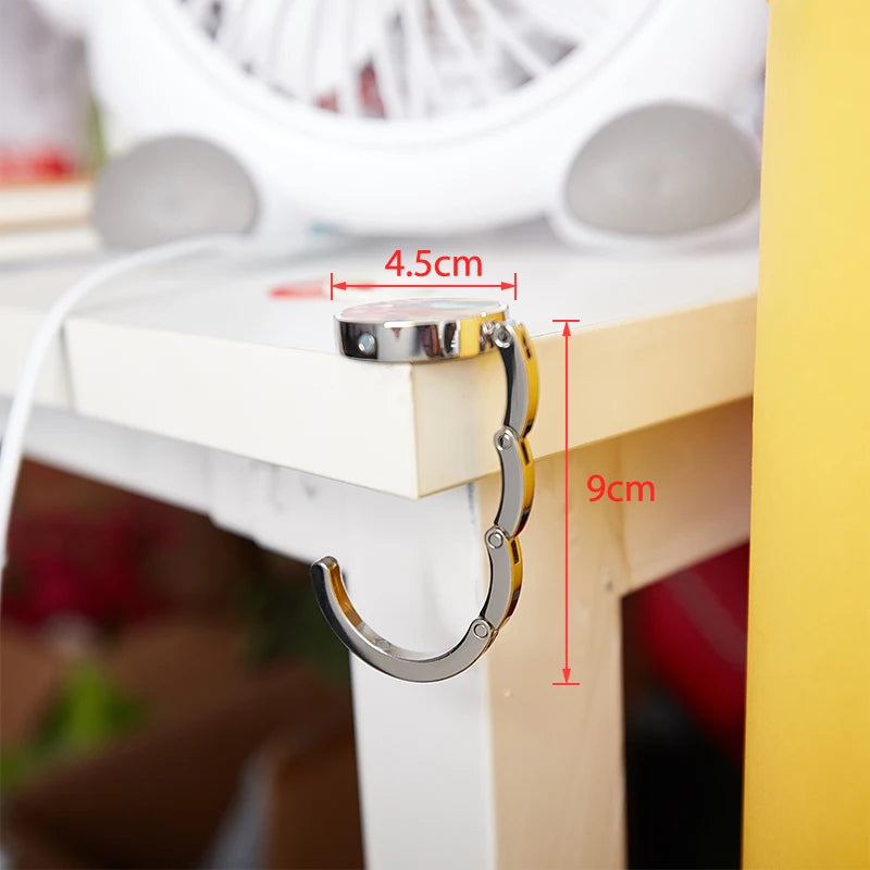 PORTABLE FOLDING BAG HANGER FOR TABLES